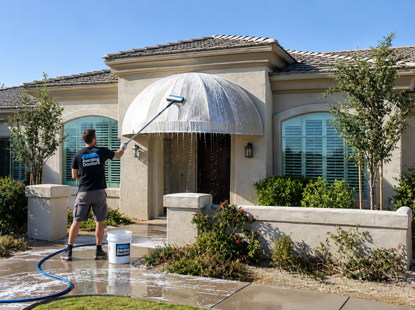 Awning Doctors technician cleaning a dome awning at a Tucson home
