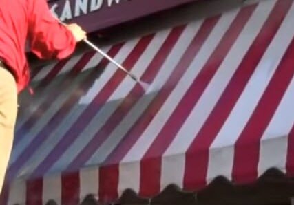 Awning before professional cleaning — dirty, faded fabric